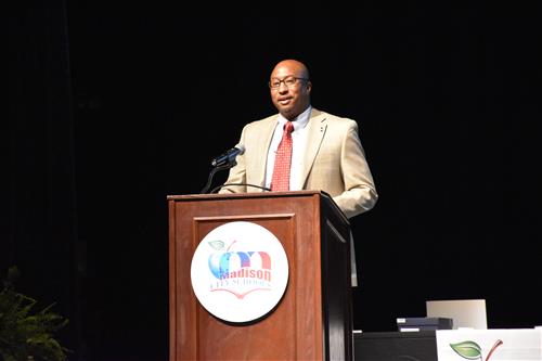 Board member Travis Cummings at Podium